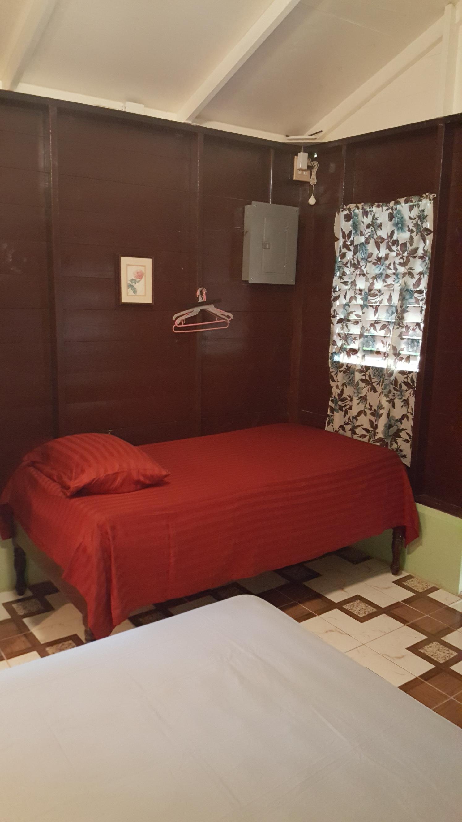 Jamaican herbal bath guest cottage bedroom bed